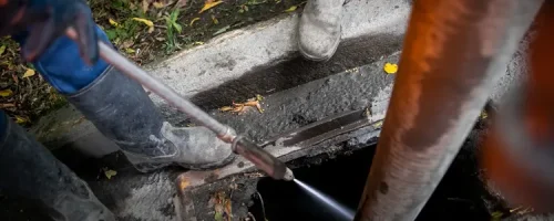 team cleaning using hydro jet machine